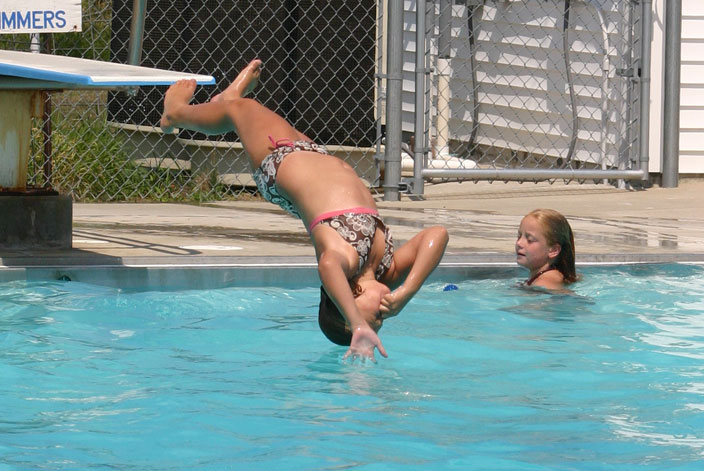 diving into an outdoor pool